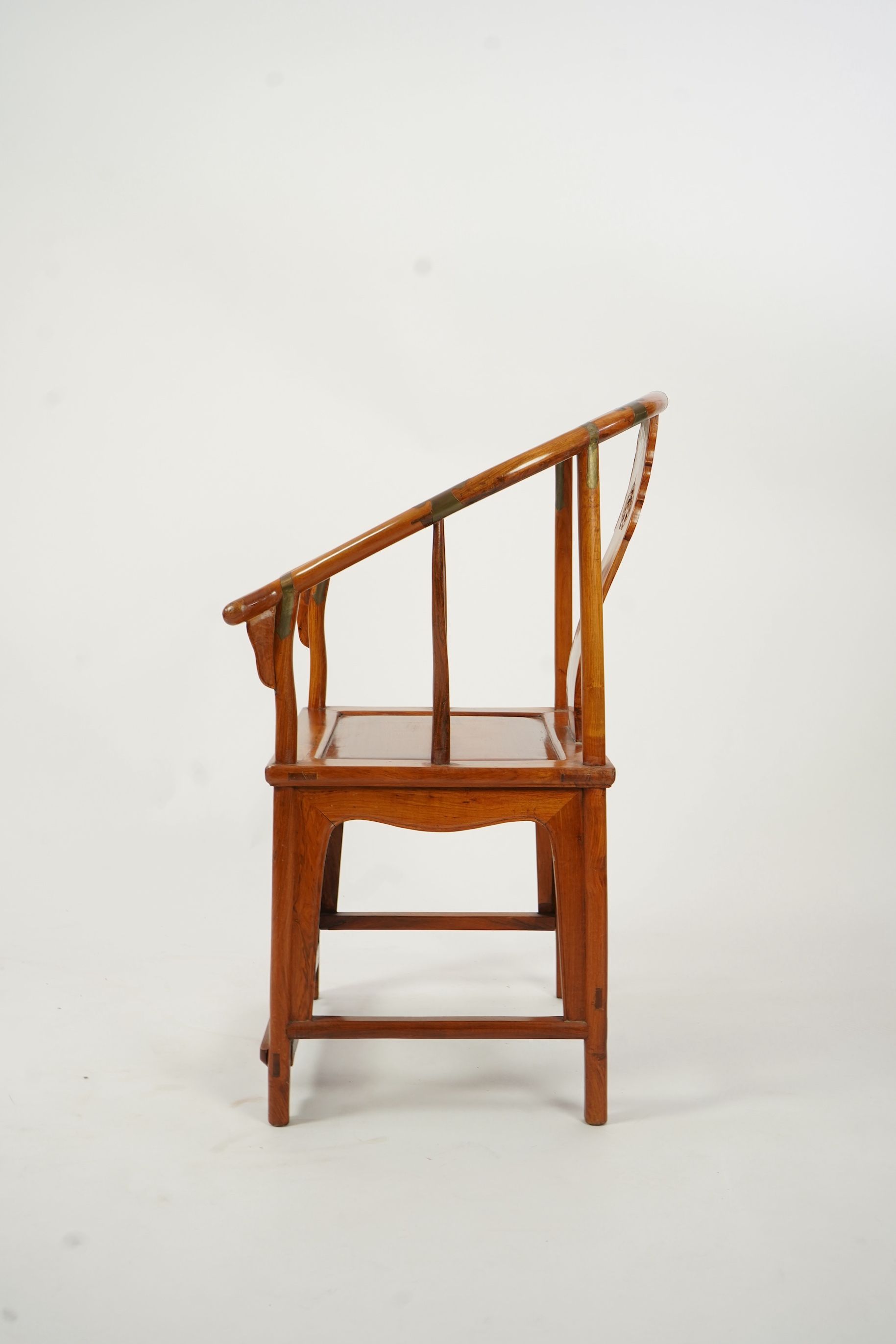A Chinese huanghuali and brass mounted horseshoe-back armchair, quanyi, late 19th century